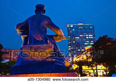 Ho Chi Minh Statue rocking to a child in front of City Hall. Ho Chi Minh City (formerly Saigon). South Vietnam. View Large Photo Image Stock Image - Ho Chi Minh Statue rocking to a child in front of City Hall. Ho Chi Minh City (formerly Saigon). South Vietnam.. Fotosearch