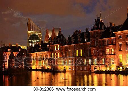 Stock Photograph - Hofvijver lake (court pond) and Binnenhof government buildings, The Hague, The Netherlands. Fotosearch
