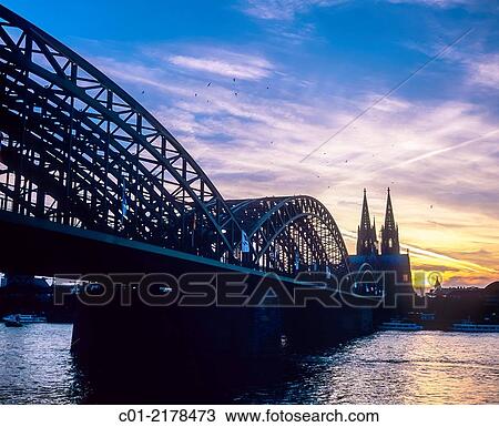 Hohenzollern bridge and cathedral at sunset Cologne Germany. View Large Photo Image Stock Image - Hohenzollern bridge and cathedral at sunset Cologne Germany.. Fotosearch