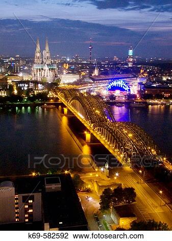 Stock Image - Hohenzollern Bridge. The Rhine River. Overview of Cologne at Dusk. Germany. Fotosearch