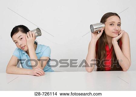 holding Disposable Cup against wall, listening View Large Photo Image Picture - holding Disposable Cup against wall, listening. Fotosearch