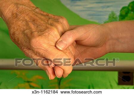 Holding hands View Large Photo Image Picture - Holding hands. Fotosearch