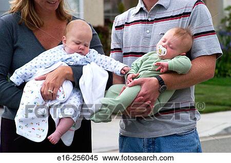 holding infants View Large Photo Image Stock Photography - holding infants. Fotosearch