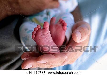 Holding newborn foot View Large Photo Image Stock Photo - Holding newborn foot. Fotosearch
