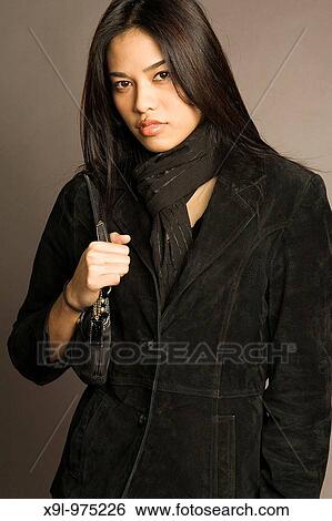 Stock Photograph - Holding purse. Fotosearch