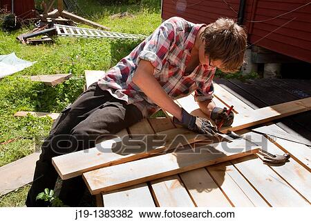 Stock Image - Holiday at summer cottage, family and relatives North of Sweden. Fotosearch