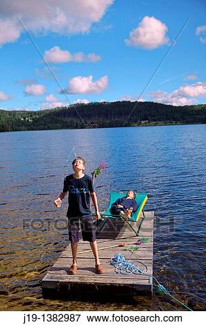 Holiday at summer cottage, family and relatives North of Sweden View Large Photo Image Stock Photo - Holiday at summer cottage, family and relatives North of Sweden. Fotosearch