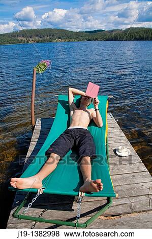 Stock Photo - Holiday at summer cottage, family and relatives North of Sweden. Fotosearch