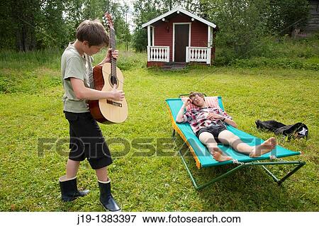 Holiday at summer cottage, family and relatives North of Sweden View Large Photo Image Stock Photo - Holiday at summer cottage, family and relatives North of Sweden. Fotosearch