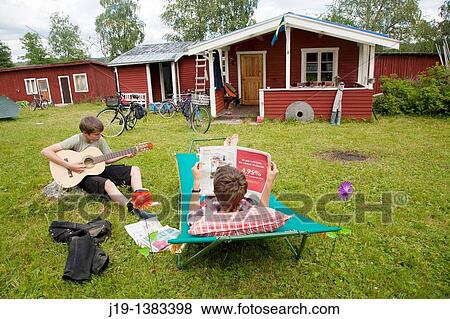 Holiday at summer cottage, family and relatives North of Sweden View Large Photo Image Stock Photo - Holiday at summer cottage, family and relatives North of Sweden. Fotosearch
