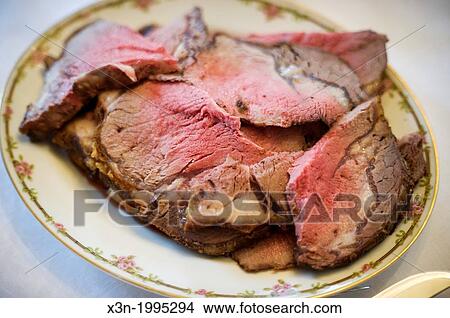 Holiday meal, roast beef on a plate. View Large Photo Image Picture - Holiday meal, roast beef on a plate.. Fotosearch