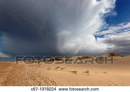 Picture - Holkham Bay National Nature Reserve Norfolk UK in April Storms.. Fotosearch