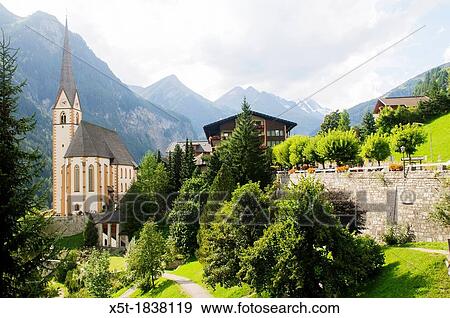 Stock Photo - Holy Vincent pilgrimage church with Mt Grossglockner in background, Heiligenblut, Hohe Tauern Range, Carinthia, Austria, Europe. Fotosearch