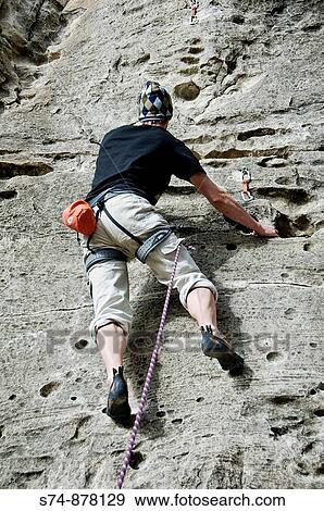 Hombre escalando en Embalse de Pedrezuela, Los Alcores, Madrid, Espaa. View Large Photo Image Stock Photo - Hombre escalando en Embalse de Pedrezuela, Los Alcores, Madrid, Espaa.. Fotosearch