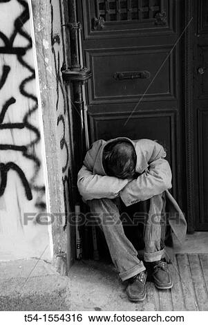 Homeless man sleeping in a doorway in Istanbul View Large Photo Image Stock Photograph - Homeless man sleeping in a doorway in Istanbul. Fotosearch