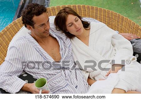 honeymoon couple sitting on sofa View Large Photo Image Stock Image - honeymoon couple sitting on sofa. Fotosearch