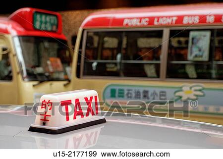 Hong Kong, China, Asia. Hong Kong Kowloon. Transport by taxi and bus. View Large Photo Image Stock Photo - Hong Kong, China, Asia. Hong Kong Kowloon. Transport by taxi and bus.. Fotosearch
