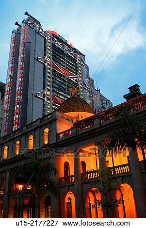 Hong Kong, China, Asia. Hong Kong Central. The luminous HSBC bank tower behind the illuminated old building of the Legislative Council. View Large Photo Image Stock Photo - Hong Kong, China, Asia. Hong Kong Central. The luminous HSBC bank tower behind the illuminated old building of the Legislative Council.. Fotosearch