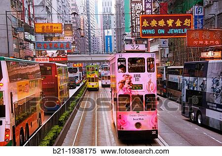 Hong Kong- Doble deck tramways at Wan Chai district, Hong Kong. View Large Photo Image Stock Photography - Hong Kong- Doble deck tramways at Wan Chai district, Hong Kong.. Fotosearch