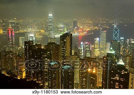 Hong Kong Island Evening night view from Victoria Peak over city centre skyscrapers and Hong Kong Harbour to Kowloon shore View Large Photo Image Stock Image - Hong Kong Island Evening night view from Victoria Peak over city centre skyscrapers and Hong Kong Harbour to Kowloon shore. Fotosearch