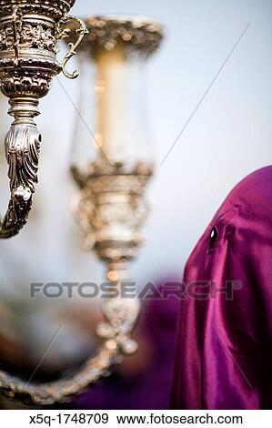 Hooded penitent behind a float, Holy Week, Seville, Spain View Large Photo Image Stock Photo - Hooded penitent behind a float, Holy Week, Seville, Spain. Fotosearch
