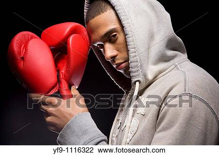 Stock Image - Hooded young man boxer.. Fotosearch