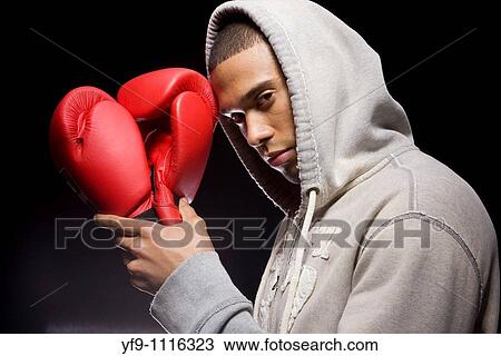 Stock Image - Hooded young man boxer.. Fotosearch
