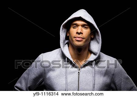 Hooded young man. View Large Photo Image Picture - Hooded young man.. Fotosearch