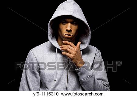 Stock Image - Hooded young man.. Fotosearch