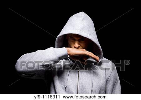 Hooded young man. View Large Photo Image Stock Image - Hooded young man.. Fotosearch