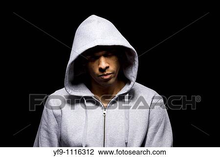 Stock Image - Hooded young man.. Fotosearch