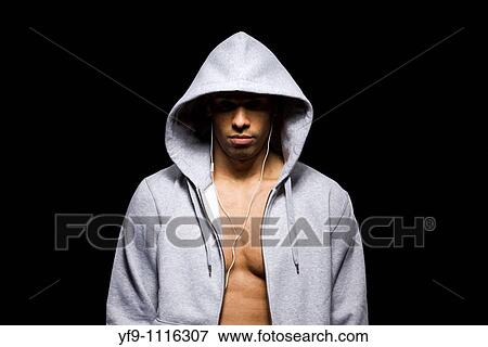 Hooded young man. View Large Photo Image Stock Photo - Hooded young man.. Fotosearch