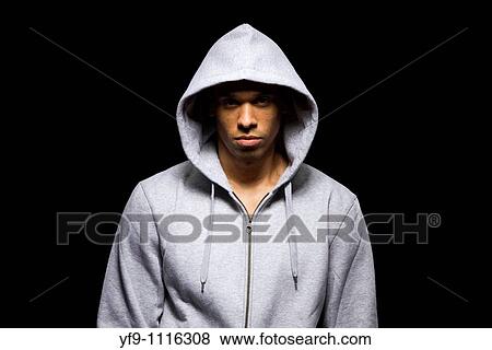 Hooded young man. View Large Photo Image Stock Photo - Hooded young man.. Fotosearch