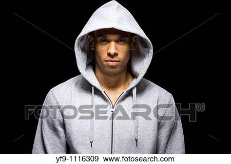 Hooded young man. View Large Photo Image Stock Photo - Hooded young man.. Fotosearch