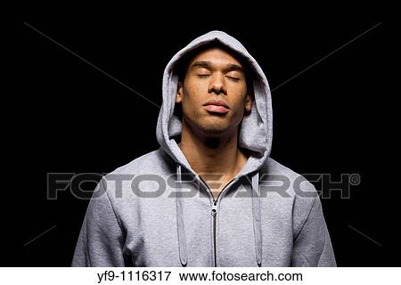 Stock Photo - Hooded young man.. Fotosearch