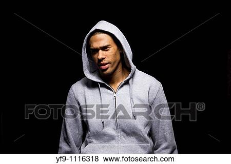 Hooded young man. View Large Photo Image Stock Photo - Hooded young man.. Fotosearch