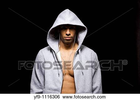 Hooded young man. View Large Photo Image Stock Photograph - Hooded young man.. Fotosearch