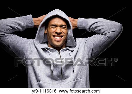 Hooded young man. View Large Photo Image Stock Photograph - Hooded young man.. Fotosearch