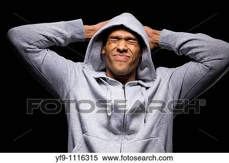Hooded young man. View Large Photo Image Stock Photography - Hooded young man.. Fotosearch