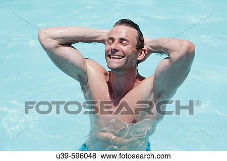 Horizontal shot of a good-looking man with a muscular torso in a swimming pool in India. View Large Photo Image Stock Photo - Horizontal shot of a good-looking man with a muscular torso in a swimming pool in India.. Fotosearch