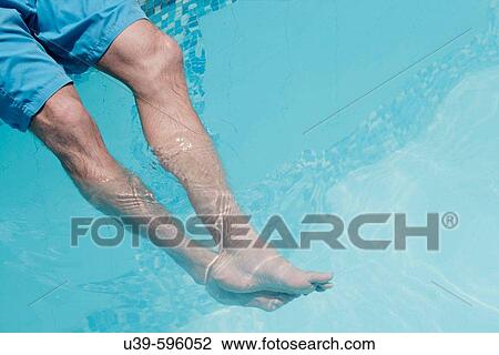 Horizontal shot of a man's legs in a swimming pool in India. View Large Photo Image Stock Image - Horizontal shot of a man's legs in a swimming pool in India.. Fotosearch