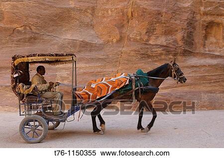 horse carriage rides through the Siq canyon in Petra, the UNESCO World Heritage Site in Jordan View Large Photo Image Stock Photography - horse carriage rides through the Siq canyon in Petra, the UNESCO World Heritage Site in Jordan. Fotosearch