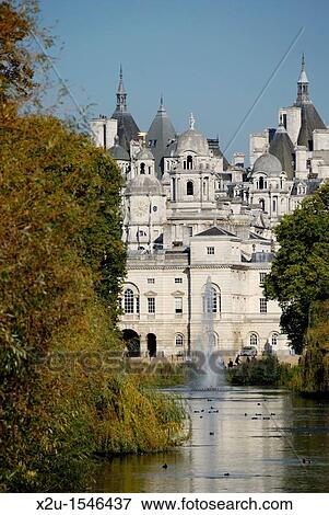 Horse Guards Parade and Whitehall buildings from St James Park, London, England View Large Photo Image Stock Photo - Horse Guards Parade and Whitehall buildings from St James Park, London, England. Fotosearch