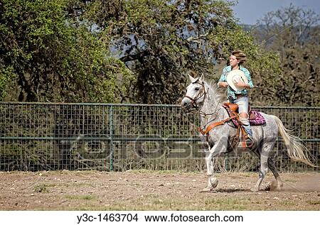 Horseback riding cowgirl View Large Photo Image Picture - Horseback riding cowgirl. Fotosearch