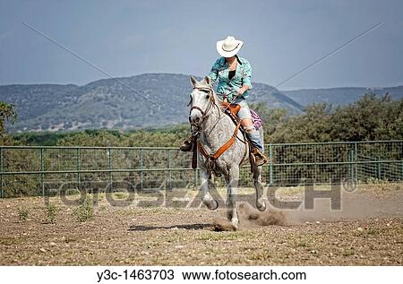 Horseback riding cowgirl View Large Photo Image Stock Image - Horseback riding cowgirl. Fotosearch