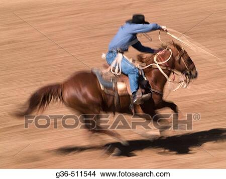 Picture - Horses and riders in rodeo event. Fotosearch