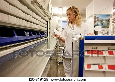 Stock Photo - Hospital pharmacy, automated storage system, preparing pharmacy medication carts. Hospital Universitario de Gran Canaria Doctor Negrin, Las Palmas de Gran Canaria. Canary Islands, Spain. Fotosearch