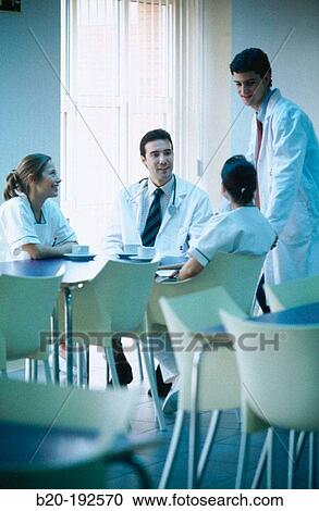 Hospital staff, chatting at the cafeteria View Large Photo Image Stock Image - Hospital staff, chatting at the cafeteria. Fotosearch