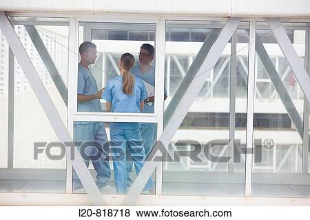 Hospital staff talking View Large Photo Image Stock Photo - Hospital staff talking. Fotosearch
