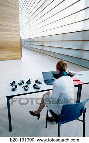 Stock Image - Hostess at convention. Fotosearch